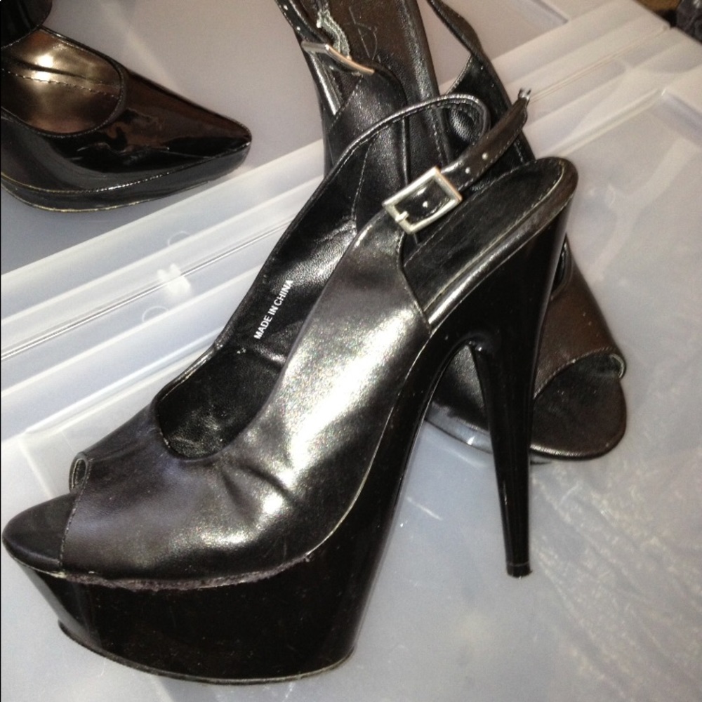 Black open toe sling back platform.